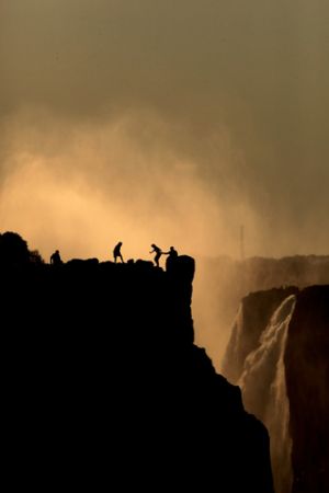 Victoria Falls Looking at Figures in Zimbabwee